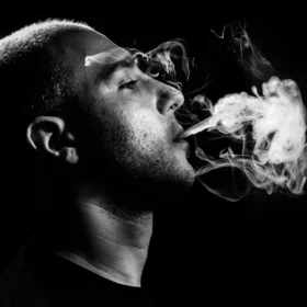 image of man smoking gumbo weed strain